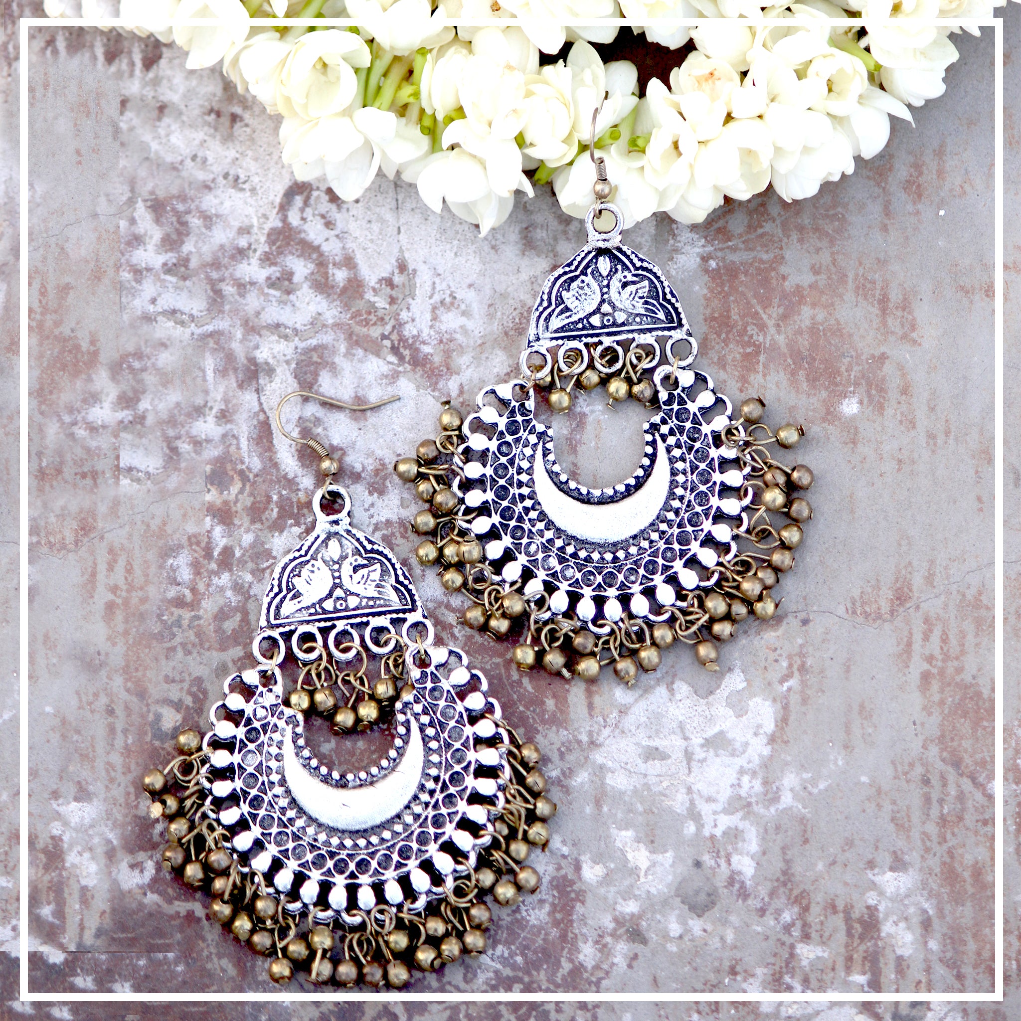 Buy Jazz and Sizzle Silver Plated & Red Stone Studded Oxidised Peacock  Shaped Drop Earrings Online